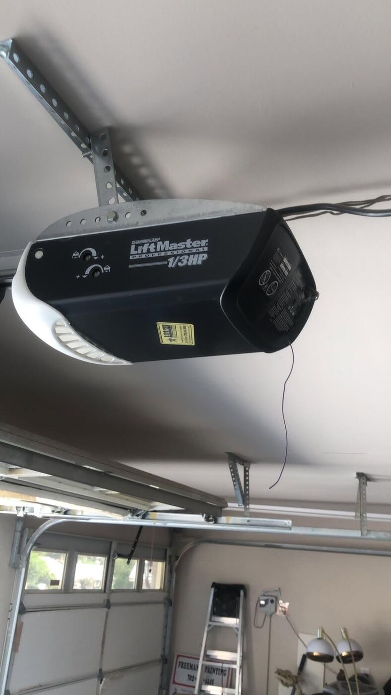 LiftMaster garage door opener installed on the ceiling track