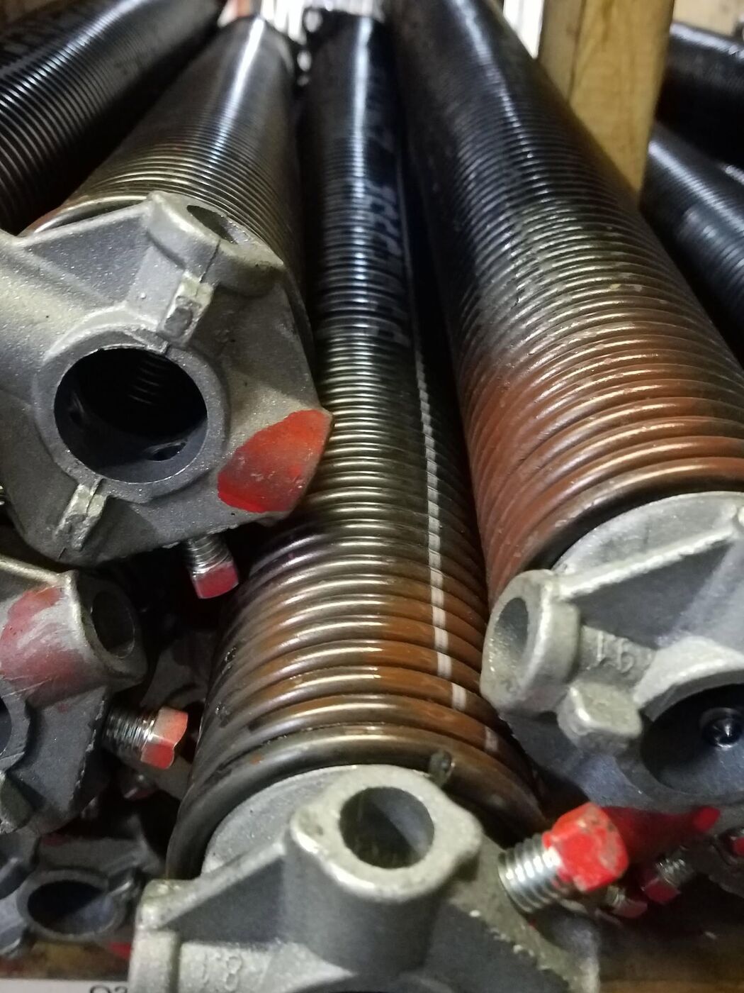 Close-up of new garage door torsion springs ready for installation