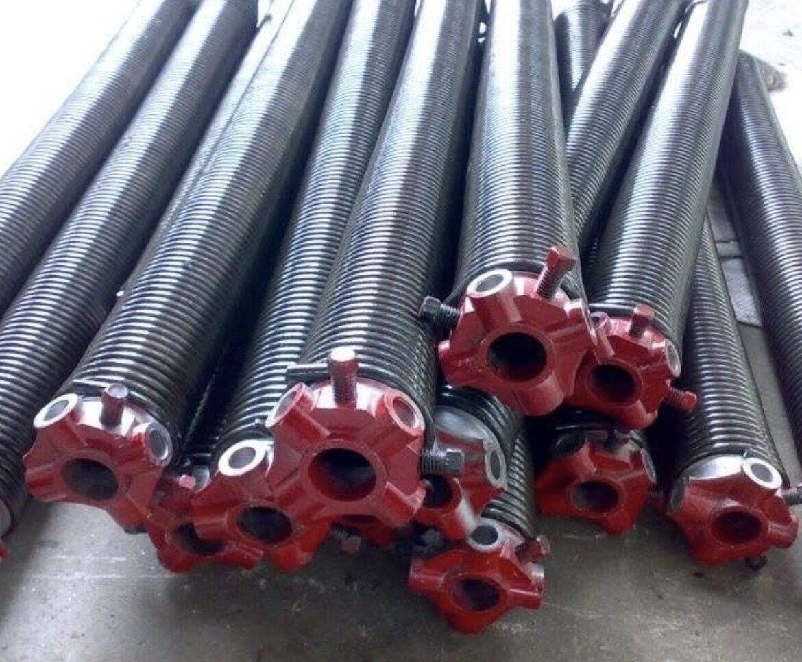 Garage door torsion springs lined up, the kind of part checked during a tune-up