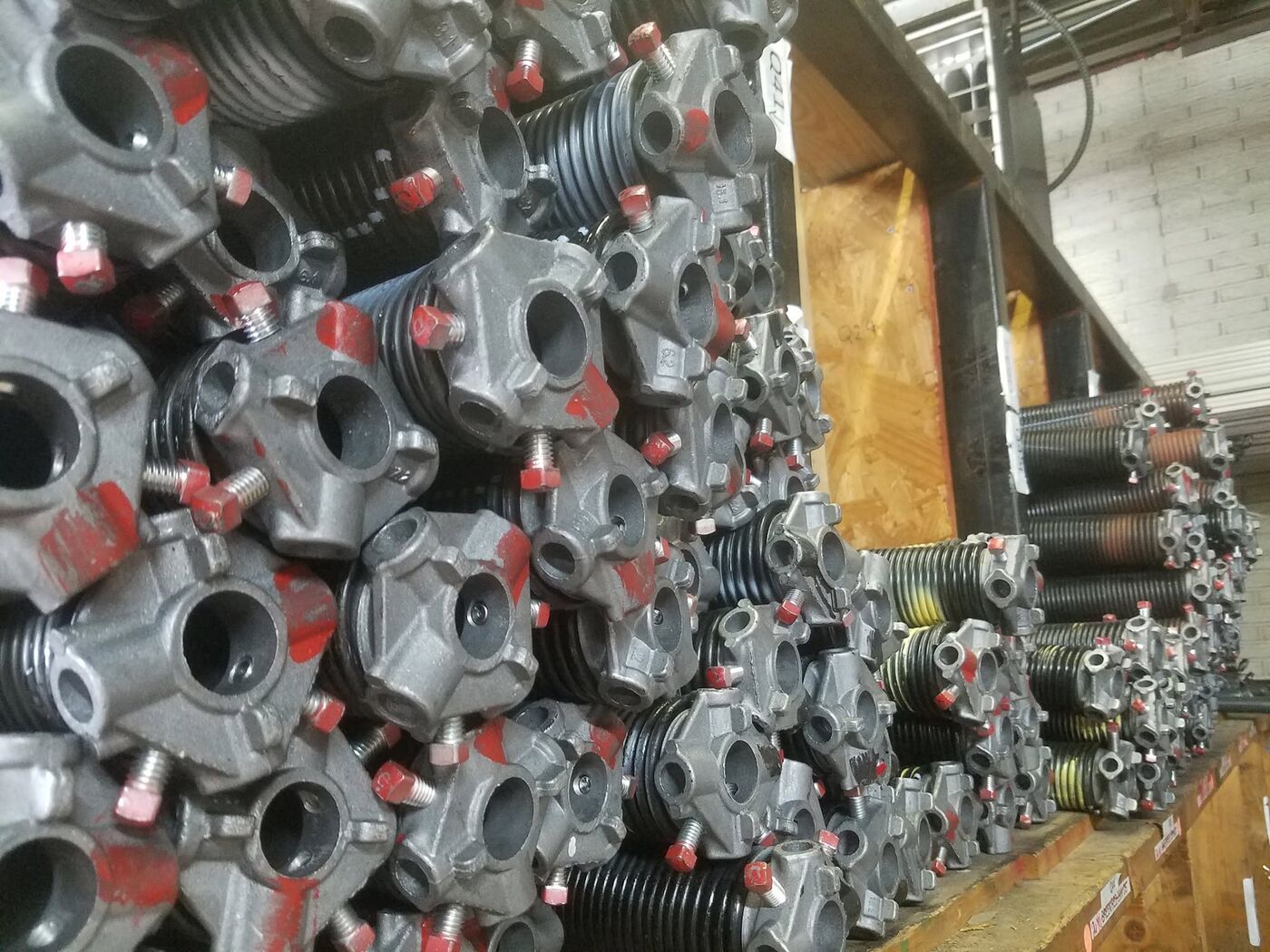 Industrial warehouse storing rolling steel door springs and hardware